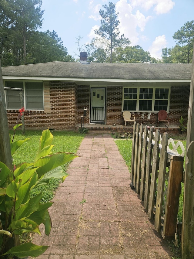 8719 Jefferies Hwy, Walterboro, SC 29488 - view of front of home with brick siding and a chimney