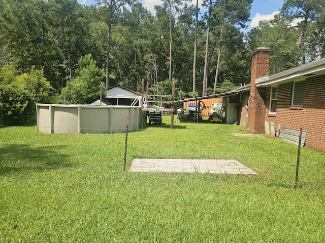 8719 Jefferies Hwy, Walterboro, SC 29488 - view of green lawn with an outdoor pool