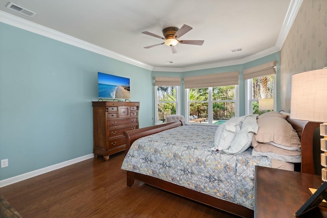 bedroom featuring visible vents, crown molding, and wood finished floors