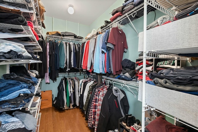 spacious closet with wood finished floors