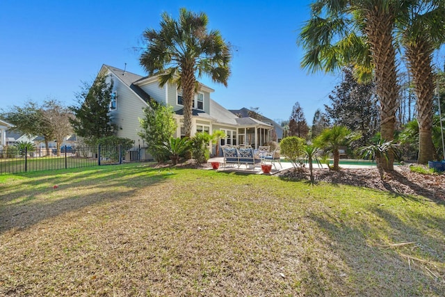 view of yard with fence, a fenced in pool, and a patio