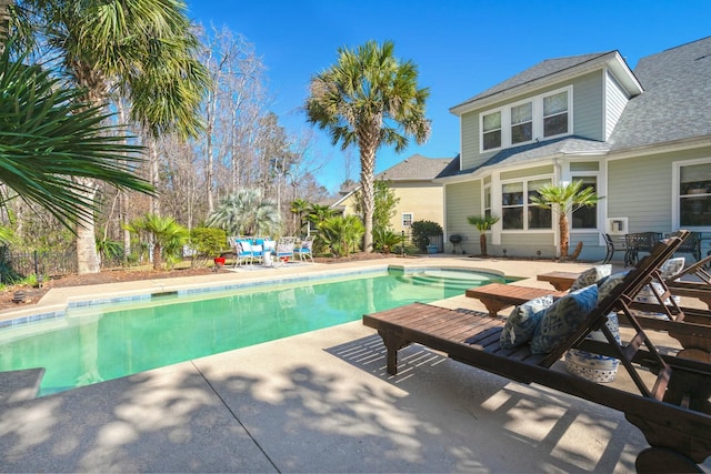 view of pool with a fenced in pool, a patio area, and fence