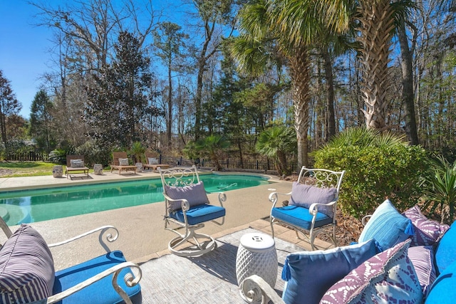 view of swimming pool with a fenced in pool, a patio, and fence