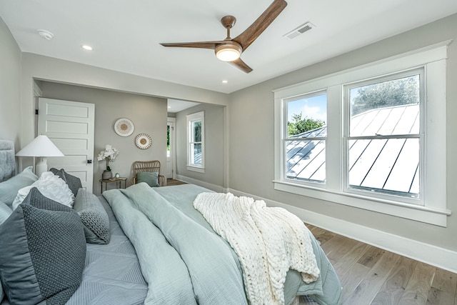 bedroom with visible vents, baseboards, ceiling fan, light wood-style floors, and recessed lighting