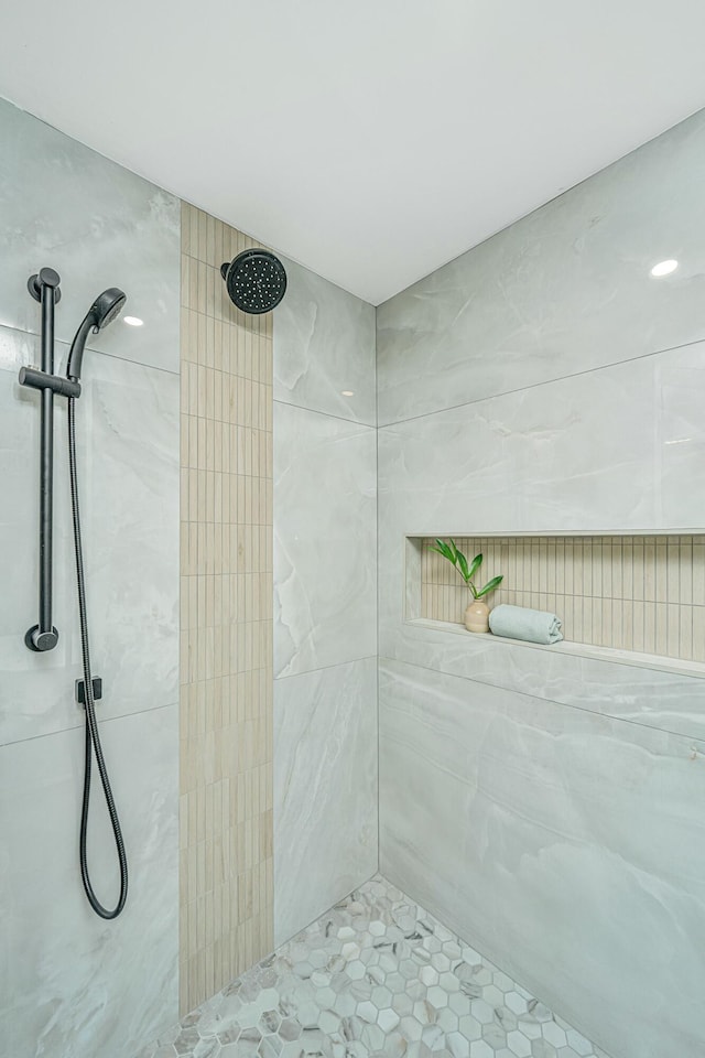 full bath with tiled shower