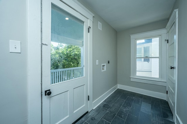 entryway featuring marble finish floor, baseboards, and visible vents