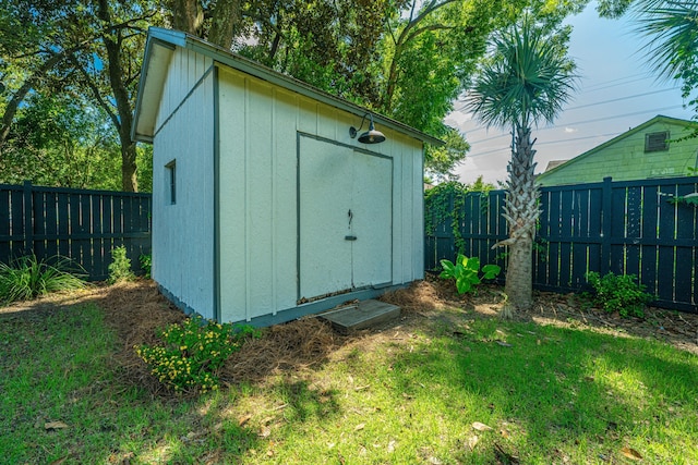 view of shed with a fenced backyard