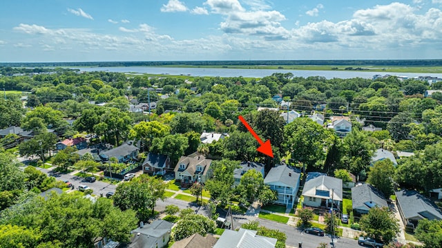 drone / aerial view with a water view and a residential view