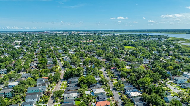 drone / aerial view featuring a residential view and a water view