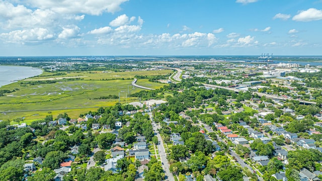 drone / aerial view featuring a residential view and a water view