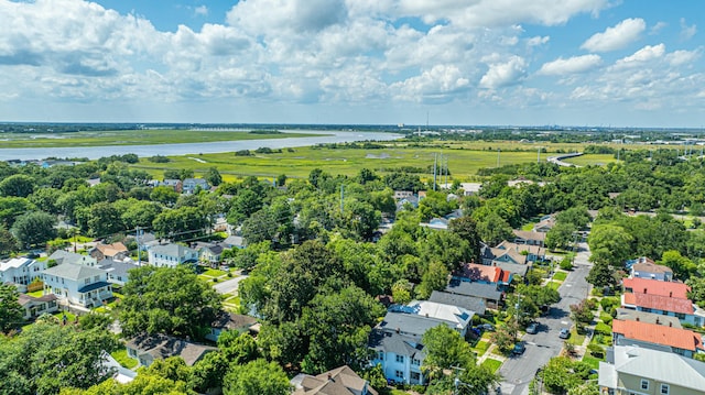drone / aerial view featuring a residential view and a water view