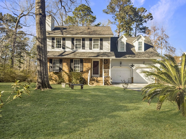 colonial home featuring a garage and a front yard