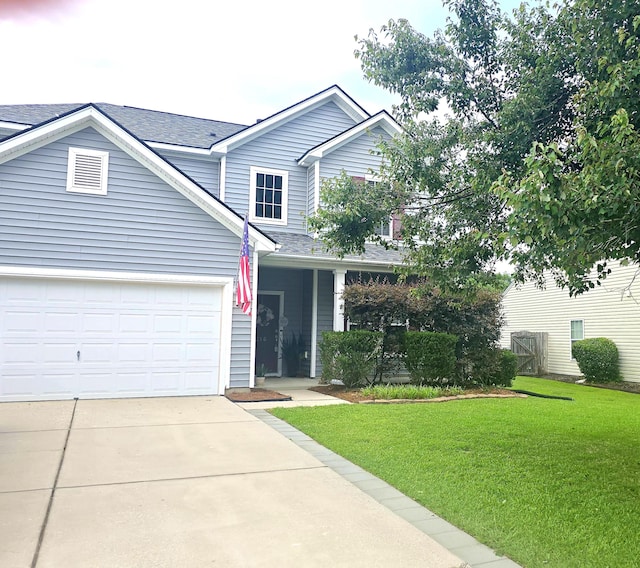 216 Goldfinch Ln, Summerville, SC 29485 - traditional-style home with a front yard, driveway, a shingled roof, and an attached garage