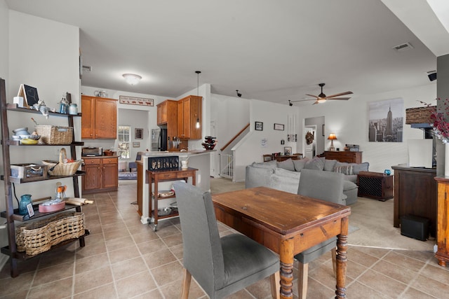 216 Goldfinch Ln, Summerville, SC 29485 - dining room featuring ceiling fan, stairway, and light tile patterned flooring