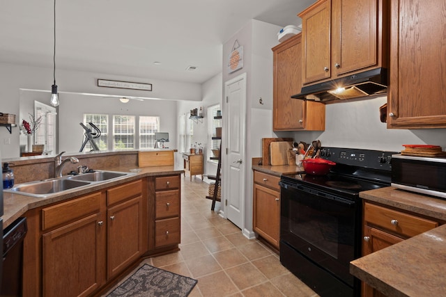 216 Goldfinch Ln, Summerville, SC 29485 - kitchen with black appliances, under cabinet range hood, a sink, light tile patterned floors, and brown cabinets