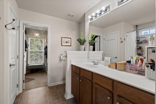 216 Goldfinch Ln, Summerville, SC 29485 - bathroom with vanity, baseboards, curtained shower, a chandelier, and tile patterned flooring