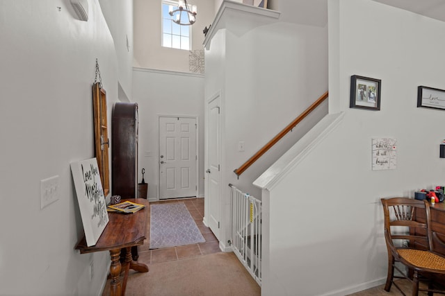 216 Goldfinch Ln, Summerville, SC 29485 - tiled foyer entrance featuring a towering ceiling, a chandelier, and stairway