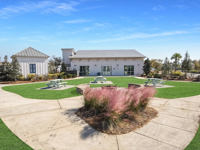 209 Celestial Blvd, Summerville, SC 29486 - rear view of house with board and batten siding, a lawn, metal roof, a standing seam roof, and french doors