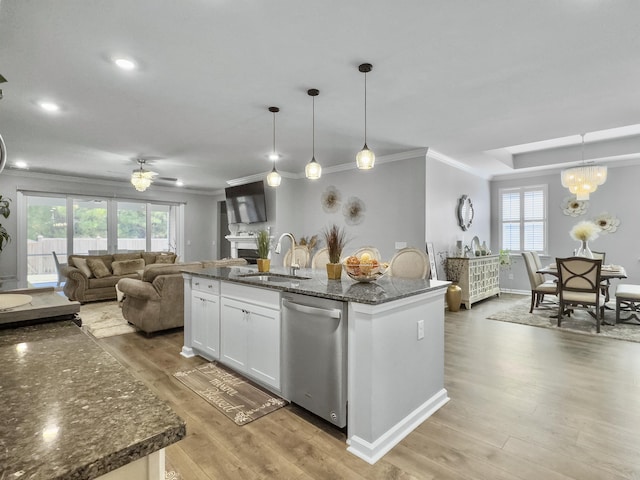 209 Celestial Blvd, Summerville, SC 29486 - kitchen featuring stainless steel dishwasher, a sink, light wood-type flooring, white cabinets, and ornamental molding