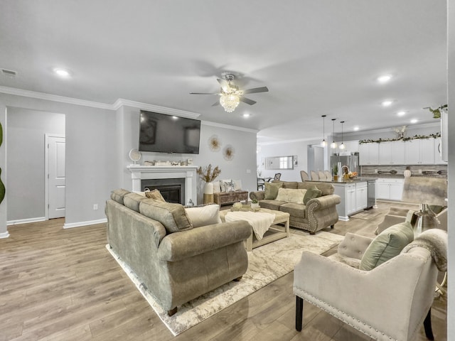 209 Celestial Blvd, Summerville, SC 29486 - living area with ceiling fan, crown molding, light wood-style flooring, a fireplace, and recessed lighting