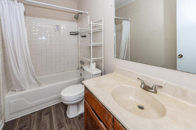 full bathroom with hardwood / wood-style flooring, vanity, toilet, and shower / tub combo