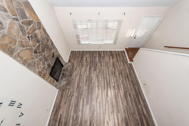 interior space with a fireplace and dark hardwood / wood-style flooring