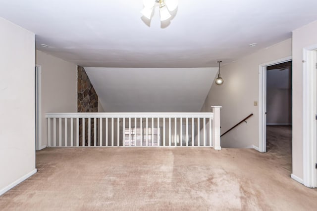 spare room with light carpet, ceiling fan, and lofted ceiling