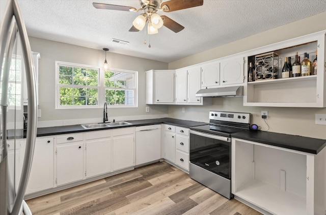 5052 Hidden Forest Ln, North Charleston, SC 29420 - kitchen featuring white appliances, under cabinet range hood, dark countertops, light wood-style flooring, and ceiling fan