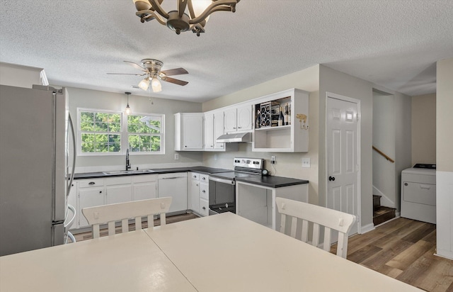 5052 Hidden Forest Ln, North Charleston, SC 29420 - kitchen featuring washer / clothes dryer, appliances with stainless steel finishes, under cabinet range hood, a textured ceiling, and wood finished floors