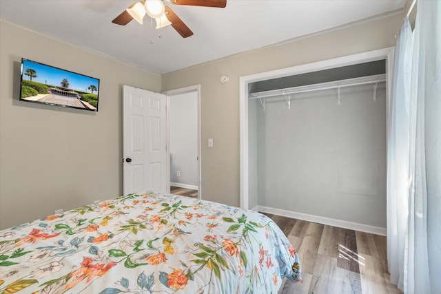 5052 Hidden Forest Ln, North Charleston, SC 29420 - bedroom with wood finished floors, a closet, and a ceiling fan