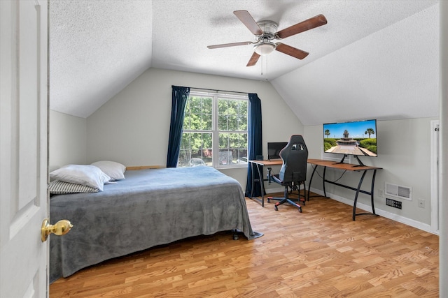 5052 Hidden Forest Ln, North Charleston, SC 29420 - bedroom with a textured ceiling, wood finished floors, lofted ceiling, a ceiling fan, and a desk