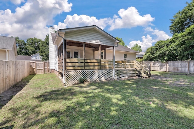5052 Hidden Forest Ln, North Charleston, SC 29420 - rear view of house with a fenced backyard, a chimney, and a wooden deck