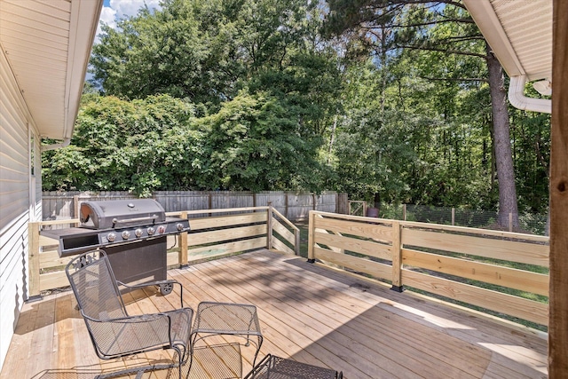 5052 Hidden Forest Ln, North Charleston, SC 29420 - deck with a grill, a fenced backyard, and view of wooded area