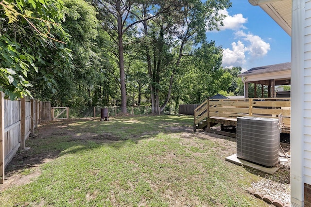 5052 Hidden Forest Ln, North Charleston, SC 29420 - fenced backyard with a wooden deck and view of scattered trees