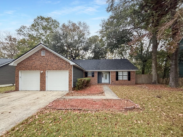 single story home featuring a garage and a front lawn