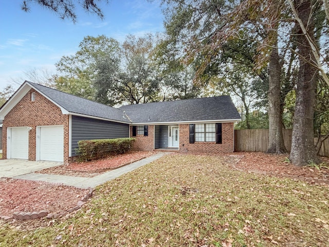 ranch-style home featuring a garage