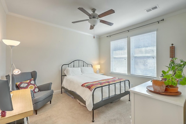 bedroom featuring light colored carpet, visible vents, and ornamental molding