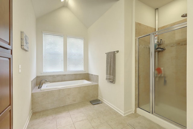 full bath featuring baseboards, lofted ceiling, a stall shower, tile patterned flooring, and a bath