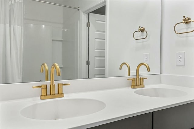 bathroom featuring a shower with curtain and vanity