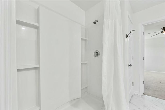 bathroom featuring a shower with curtain and ceiling fan