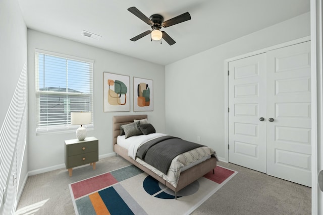 bedroom featuring carpet flooring, ceiling fan, and a closet