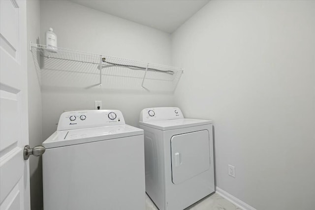 laundry area with independent washer and dryer