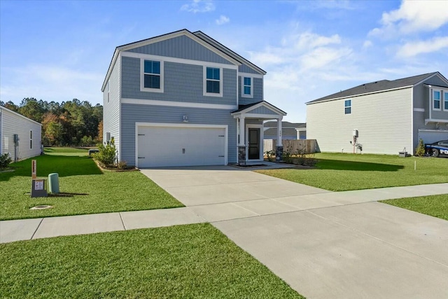 view of front property featuring a garage and a front lawn