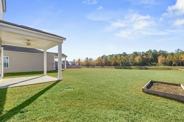 view of yard with ceiling fan