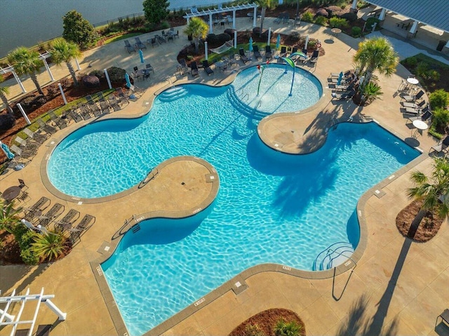 view of swimming pool with a patio area