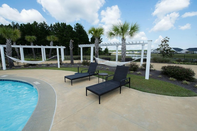 view of swimming pool featuring a pergola