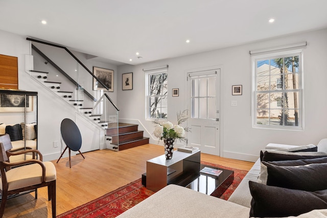 301 Broad St Unit 1, Charleston, SC 29401 - living room with stairs, wood finished floors, baseboards, and recessed lighting