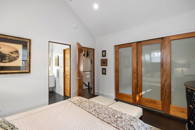301 Broad St Unit 1, Charleston, SC 29401 - bedroom with high vaulted ceiling, dark wood-style floors, and ensuite bath