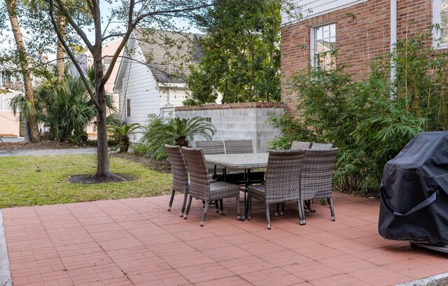 301 Broad St Unit 1, Charleston, SC 29401 - view of patio featuring outdoor dining area and a grill