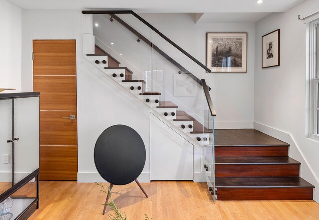 301 Broad St Unit 1, Charleston, SC 29401 - stairway with wood finished floors and recessed lighting